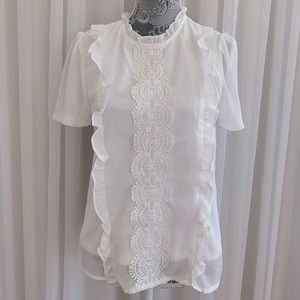 white top with lace and detailing